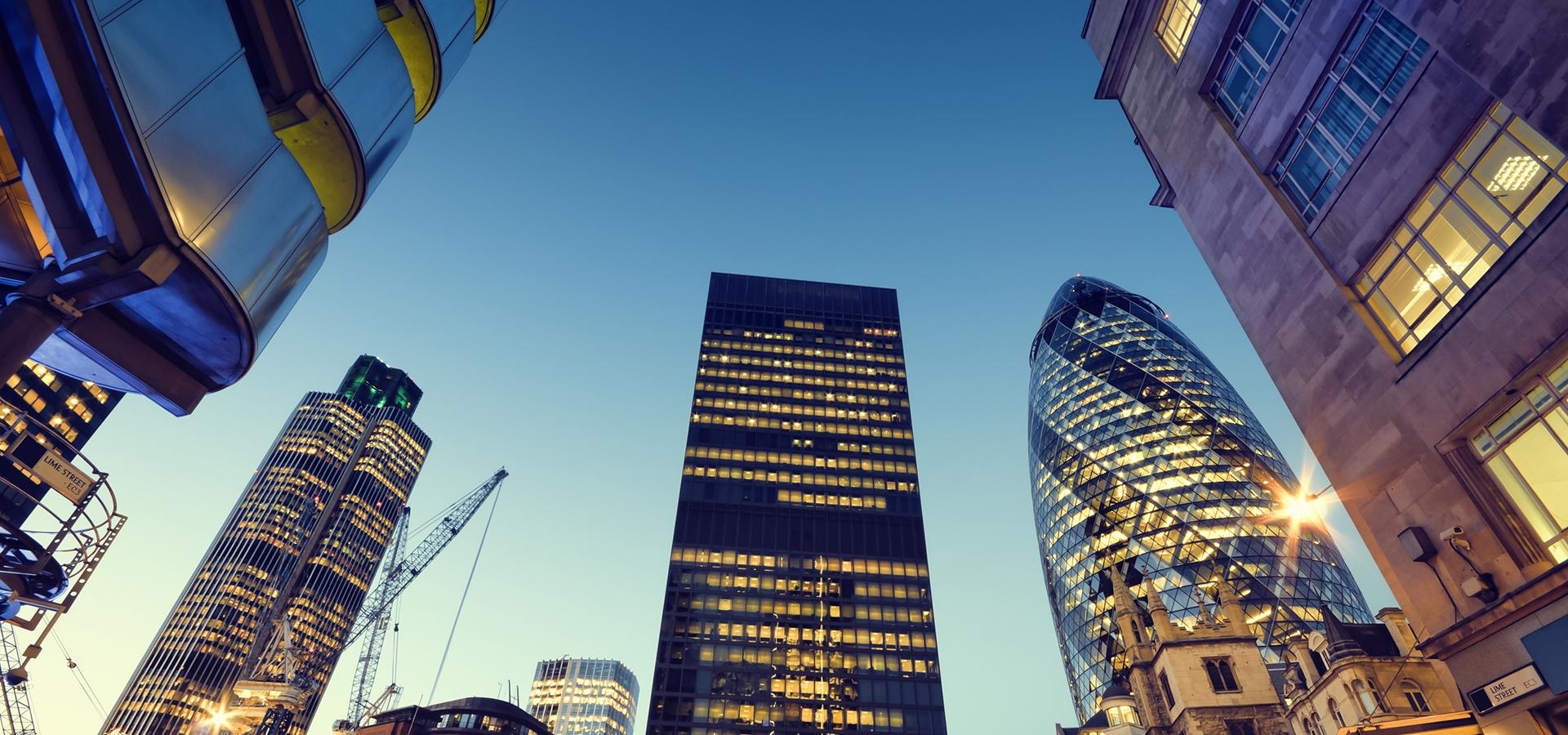 The City of London at dusk, office towers lit from within