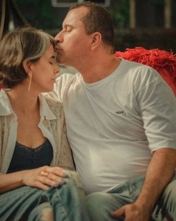 Couple sharing a kiss at home