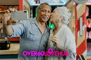 Happy over 60 couple embracing and taking a selfie during a meaningful dating moment