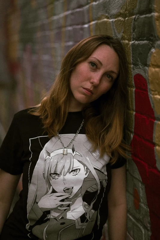 Illustrative photo of a fan wearing anime-themed clothing, not an actual member