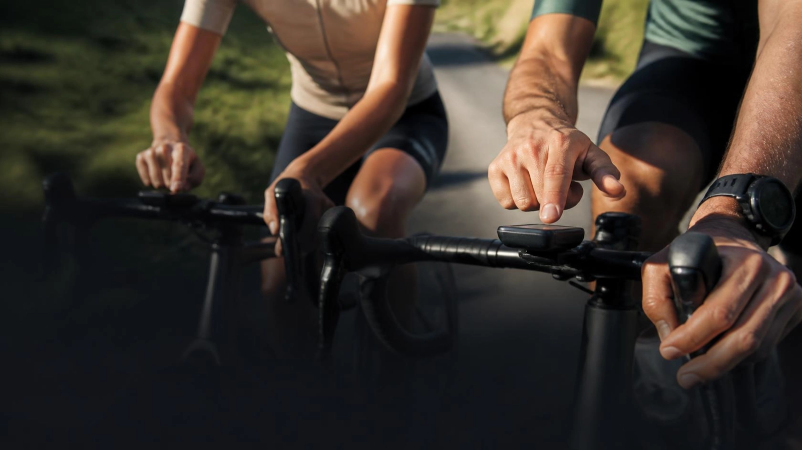 Cyclist checking a phone app, representing the features of CyclingSingles.co